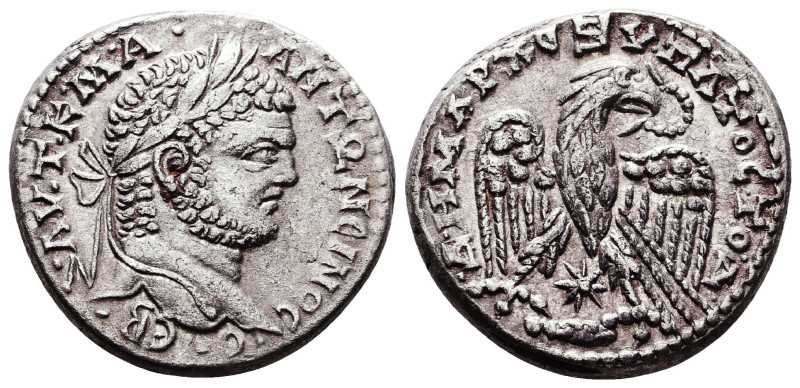 Caracalla (AD 198-217). AR tetradrachm. Laureate head of Caracalla right / Eagle...