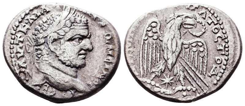 Caracalla (AD 198-217). AR tetradrachm. Laureate head of Caracalla right / Eagle...