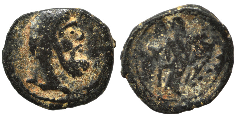 Greek. Ae (bronze, 0.62 g, 10 mm). Bust right. Rev. Uncertain figure standing, f...