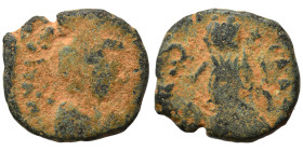 Uncertain, circa 5th centuries AD. Ae (bronze, 1.39 g, 12 mm). Diademed, draped, and cuirassed bust right. Rev. Victory advancing left, holding trophy...