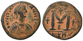 Justinian I, 527-565. Follis (bronze, 16.62 g, 32 mm), Nicomedia. D N IVSTINIANV Diademed, draped and cuirassed bust right. Rev. Large M, cross to lef...