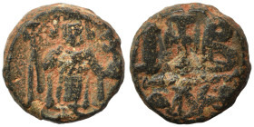 Constans II, 641-668. 12 Nummi (bronze, 9.73 g, 17 mm), Alexandria. Constans II standing facing, wearing crown surmounted by cross, holding long cross...