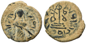 Arab Byzantine. Umayyad Caliphate. al-Malik ibn Marwan, AH 65-86 / 685-705 AD. Fals (bronze, 3.57 g, 19 mm), 'Standing Caliph' type. Caliph standing f...