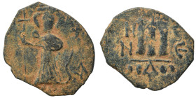 Arab Byzantine. Umayyad Caliphate, circa AD 641-660. Fals (bronze, 3.77 g, 22 mm). Pseudo-Byzantine type, imitating the types of Constans II. Standing...