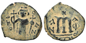 Arab Byzantine. Umayyad Caliphate, circa AD 641-660. Fals (bronze, 3.30 g, 22 mm). Pseudo-Byzantine type, imitating the types of Constans II. Standing...