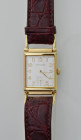 HAMILTON -Orologio da polso- Cal. al quarzo. Cassa rettangolare anatomica placcata in oro con misure 27x24mm. Dial bianco con numeri arabi dorati. Sec...