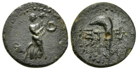 PISIDIA. Etenna. Ae (1st century BC).
Obv: Nymph advancing right, head left, holding serpent; vase to left.
Rev: E T - E.
Sickle-shaped knife or harpa...