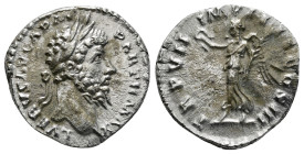 LUCIUS VERUS (161-169). Denarius. Rome.
Obv: L VERVS AVG ARM PARTH MAX.
Laureate head right.
Rev: TR P VII IMP IIII COS III.
Victory standing left, ho...