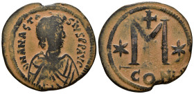 ANASTASIUS I (491-518). Follis. Constantinople.
Obv: D N ANASTASIVS P P AVG.
Diademed, draped and cuirassed bust right.
Rev: Large M; star to left and...