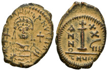 Justinian I. AD 527-565. Dated RY 37=AD 563/4 or 38=AD 564/5. Theoupolis (Antioch) Decanummium Æ 6,04 g - 26,20 mm Helmeted, and cuirassed bust facing...