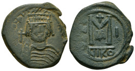 HERACLIUS (610-641). Follis. Nicomedia. RY 1 (610/1). Obv: Helmeted and cuirassed bust facing, holding globus cruciger and shield decorated with horse...