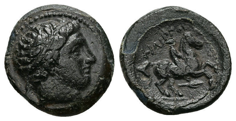 Kings of Macedon. Philip II. AE, 5.21 g 18.63 mm. 359-336 BC.
Obv: Diademed head...