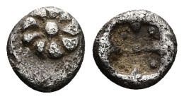 Ionia, Uncertain, Erythrai?. AR Tetartemorion, 0.14 g 4.87 mm. Circa 530-480 BC.
Obv: Rosette formed from nine curved arms around a pellet.
Rev: Shape...
