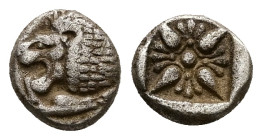 Ionia, Miletos. AR Obol or Hemihekte, 1.12 g 9.37 mm. Late 6th-early 5th centuries BC.
Obv: Forepart of lion right, head left.
Rev: Stellate floral de...