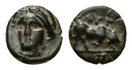 Ionia, Phygela. Ae, 0.69 g 7.98 mm. Circa 350-300 BC. 
Obv:Laureate head of Artemis Munychia facing slightly to left 
Rev: Bull butting right, ΦYΓ abo...