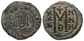 Theophilus, AD 829-842. AE, Follis. 6.87 g. 26.73 mm. Constantinople.
Obv: ✷ΘE-OFILbASIL. Crowned, three-quarter length figure of Theophilus facing, w...