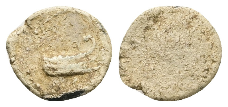 PB Greco-Roman tessera (AD 1st–3rd centuries)
Obv: Prow of galley, right; illegi...