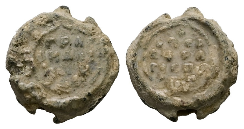 PB Byzantine metrical seal (AD 11th century)
Obv: Inscription of four lines. Bor...