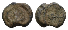 PB Byzantine lead seal (AD 6th–7th centuries)
Obv: Eagle with uplifted wings and head turned to left. Wreath border.
Rev: Illegible cruciform monogram...
