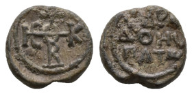 PB Byzantine seal of Bradoes, hypatos (AD 7th–8th centuries)
Obv: Cruciform invocative monogram (type I): Θεοτόκε βοήθει. Wreath border.
Rev: Inscript...