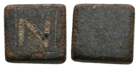 AE Byzantine one-nomisma weight. Eastern Mediterranean/Aegean (AD 5th-6th centuries)
Square in form with plain profile; engraved on the top with the d...