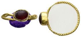 Roman gold finger-ring with gemstone (c. AD 1st century) 
Gold finger-ring; twisted wire hoop; raised oval bezel with garnet inset. 
Weight: 1.84 g.
D...