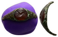 Greco-Roman intaglio gem in a bronze ring (AD 2nd–3rd centuries)
A bronze ring with intaglio carnelian depicting a hound, running to the left. 
Weight...
