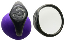 AE Roman finger-ring (AD 1st – 3rd centuries)
Bronze finger-ring; flattened oval bezel with engraved design: lion standing, r; head back.
Weight: 3.47...