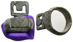 Byzantine key-ring (AD 6th-8th centuries)
A bronze finger ring with rectangular plaque; incised linear design; lateral plate with central u-shaped voi...