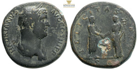 Hadrian Æ Sestertius. Rome, AD 134-138. HADRIANVS AVG COS III P P, bareheaded and draped bust right / FELICITAS AVGVSTI, Hadrian standing to right hol...