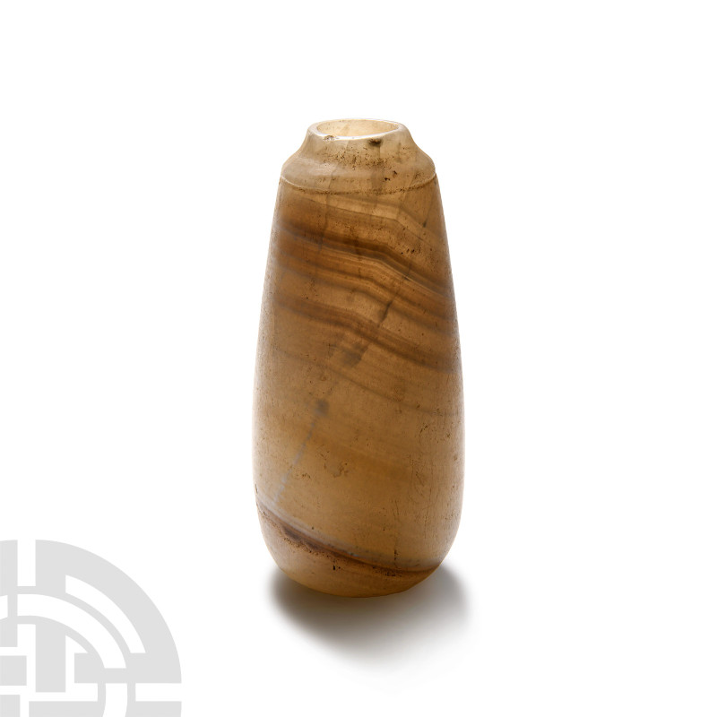 Egyptian Banded Alabaster Alabastron
Late Period, 664-332 B.C. With a tapering ...