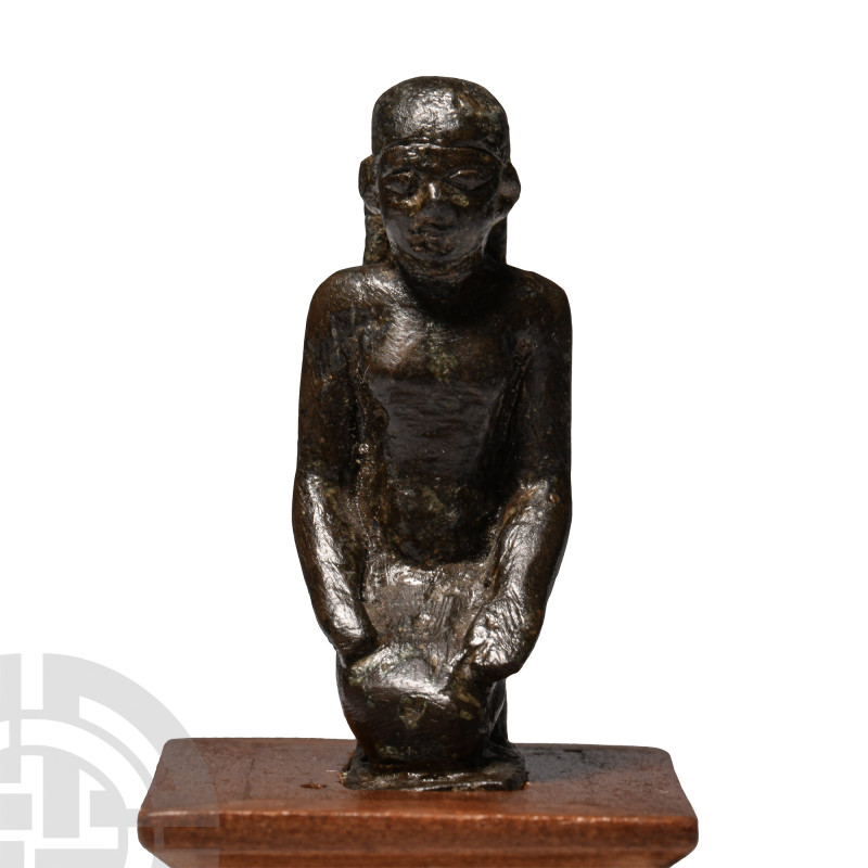 Egyptian Bronze Kneeling Priest Statuette
Late Period, circa 664 - 332 B.C. The...
