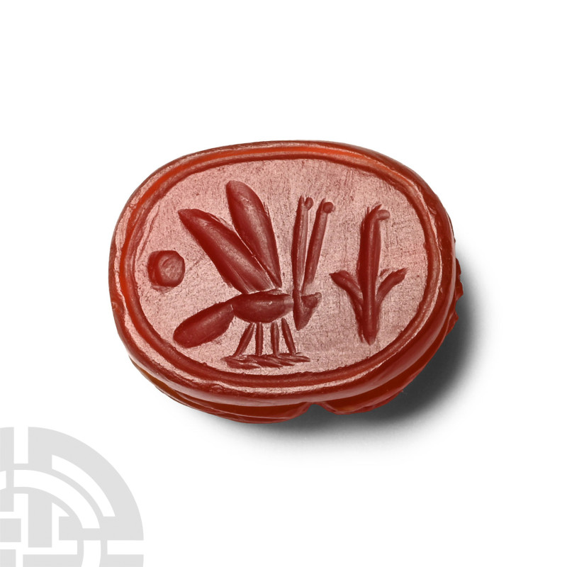 Egyptian Carnelian Scarab with Symbols
New Kingdom, 1550-1070 B.C. With rounded...