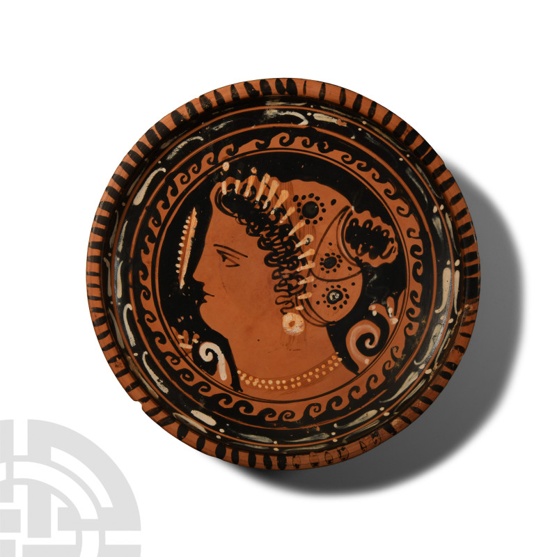 Greek Red Figure Dish with Lady of Fashion
South Italian, circa 380-350 B.C. Wi...