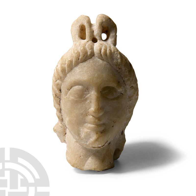 Graeco-Parthian Marble Head of a Divinity
2nd century B.C.-1st century A.D. Wit...