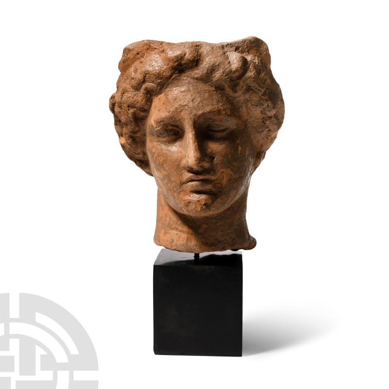 Greek Terracotta Head of a Woman
3rd-2nd century B.C. With elaborate band of cu...