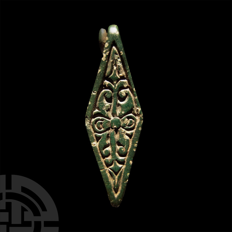 Anglo-Saxon Gilt Chip-Carved Bronze Lozengiform Brooch
Early 9th century A.D. P...