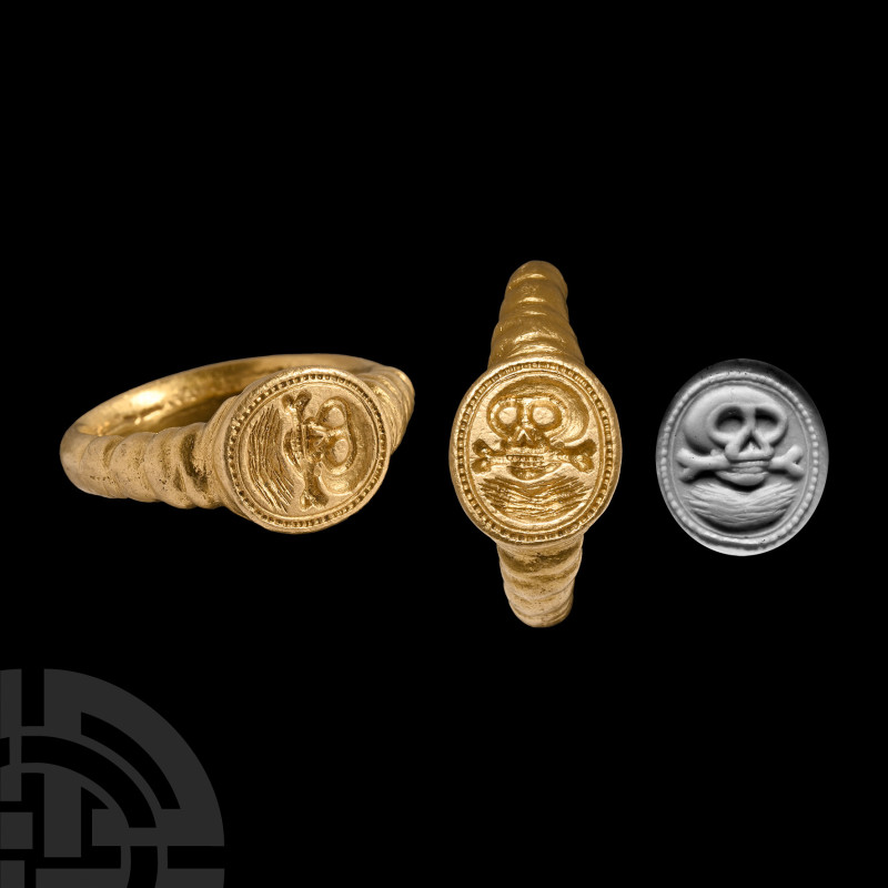 German Memento Mori Signet Ring
Circa 1600 A.D. Substantial gold hoop with ribb...