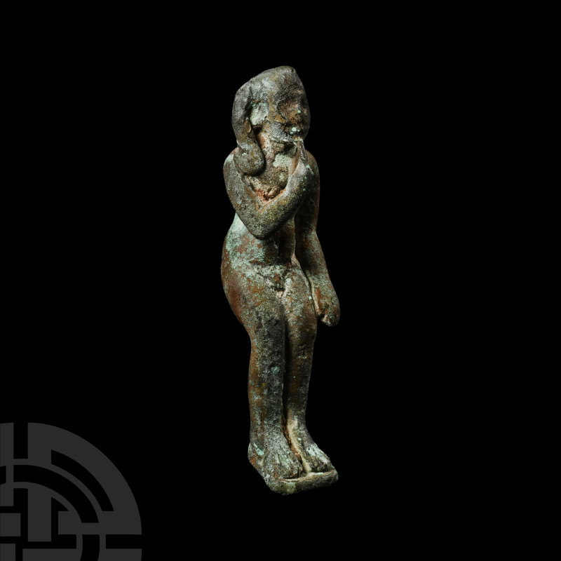 Egyptian Bronze Seated Harpocrates Figure
Late Period, 664-332 B.C. With feet r...