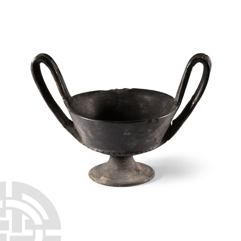 Etruscan Bucchero Kantharos Cup
Circa 7th-6th century B.C. Black ceramic with b...