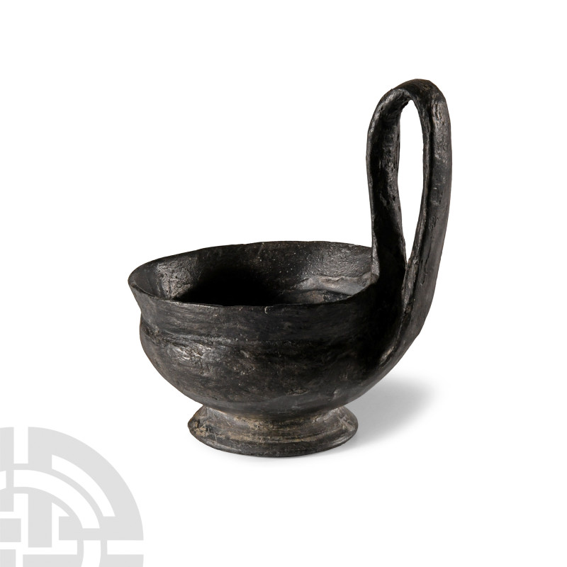 Etruscan Bucchero Kyathos
Circa 6th-5th century B.C. Blackware vessel with cari...