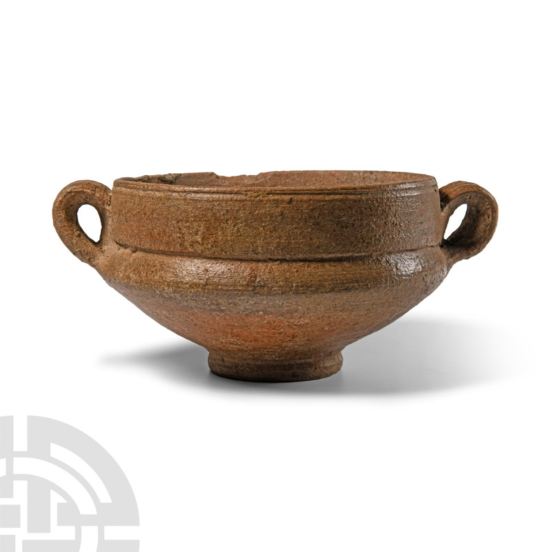 Roman Terracotta Wine Cup
Circa 1st-2nd century A.D. With a wide body and low b...