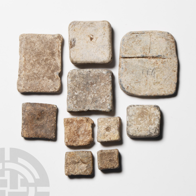 Roman Lead Weight Group
1st-4th century A.D. Tabular in form with punched dimpl...