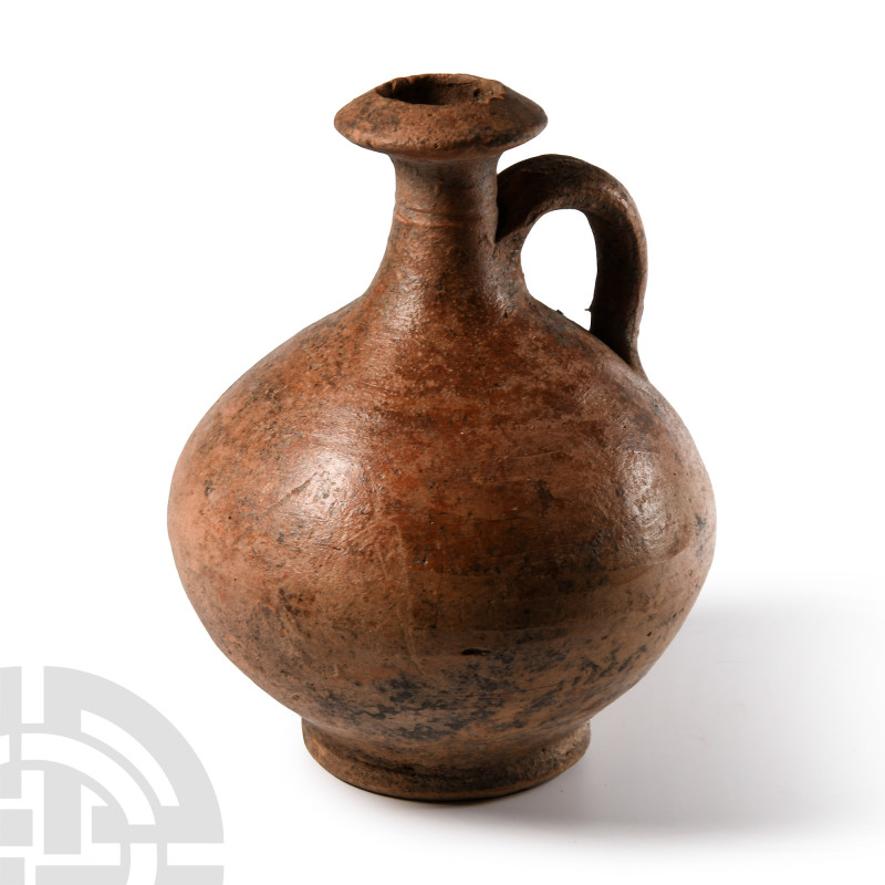 Roman Terracotta Wine Flagon
Circa 1st-2nd century A.D. With globular body, thi...