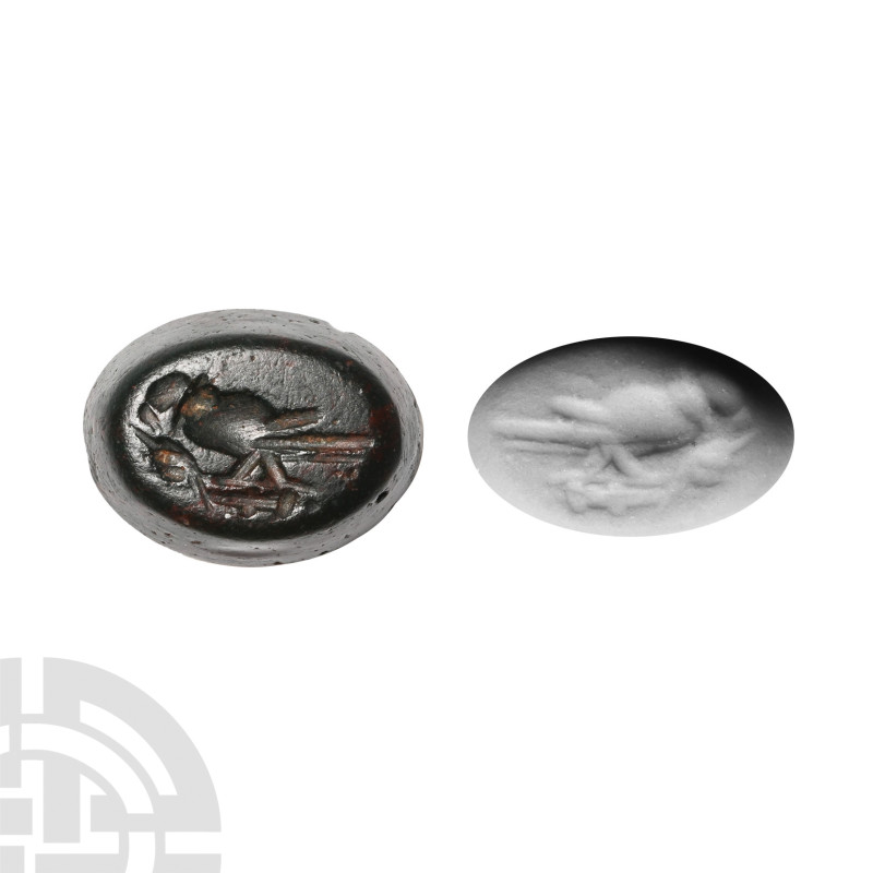 Roman Intaglio Gemstone
Circa 2nd-3rd century A.D. With intaglio bird perching ...