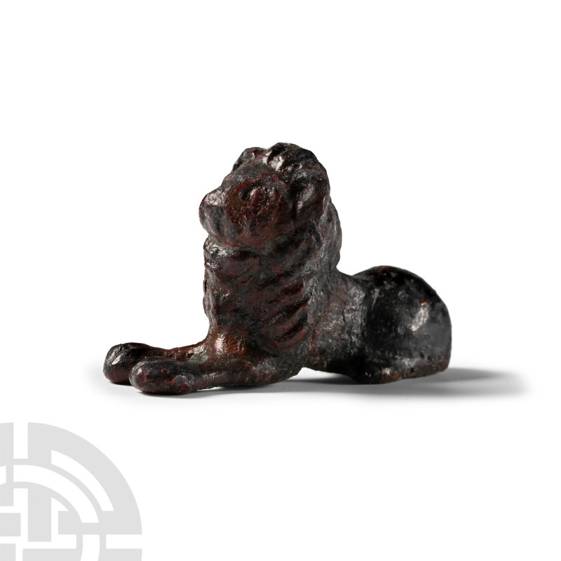 Roman Bronze Lion Statuette
1st-3rd century A.D. Crouching adult male lion with...