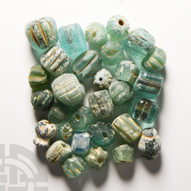 Roman Turquoise Blue Glass Melon and Other Bead Collection
1st-2nd century A.D....