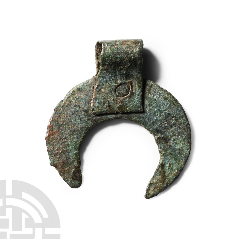 Roman Bronze Lunar Pendant
Circa 1st-3rd century A.D. With flat-section body, s...