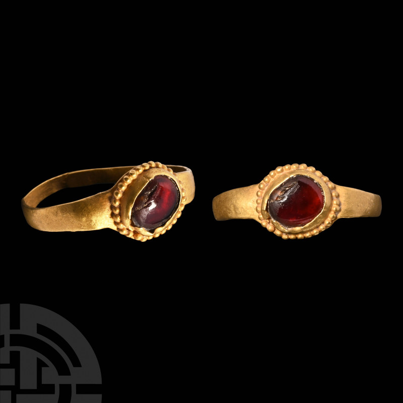 Roman Gold Ring with Garnet
3rd-4th century A.D. Comprising a slender hoop with...