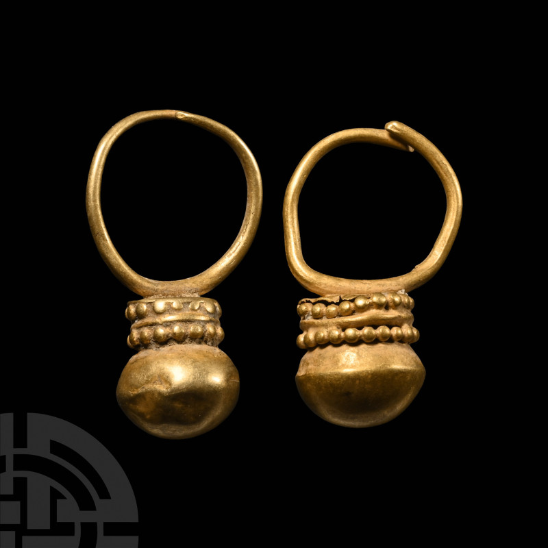 Western Asiatic Gold Earring Pair
1st millennium B.C. Matched pair each with a ...